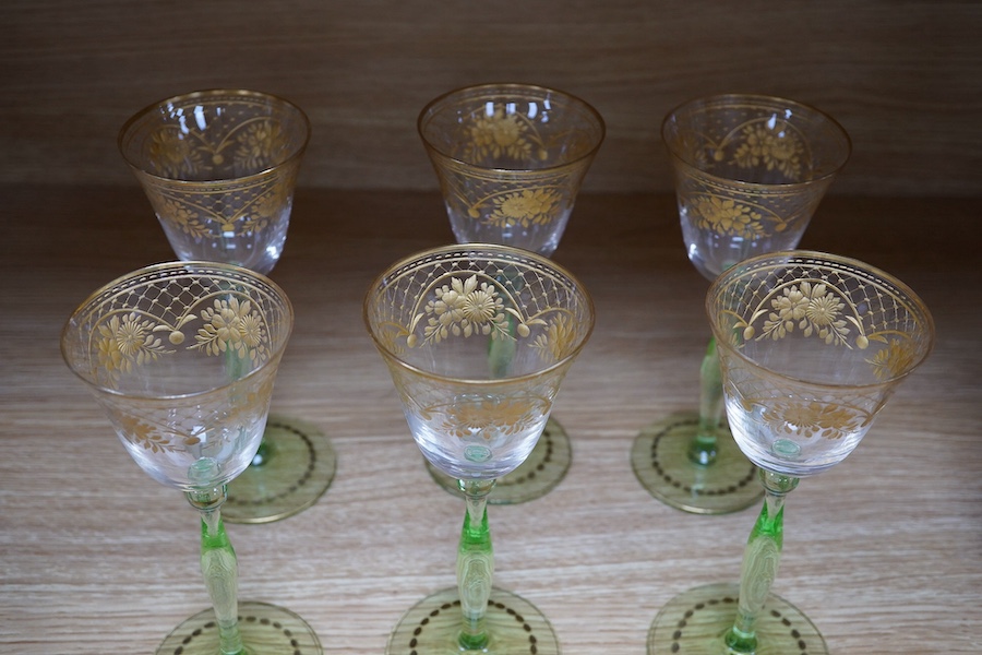 A set of six Bohemian wine glasses with ornate gilt decorated bowls, height 19cm. Condition - good